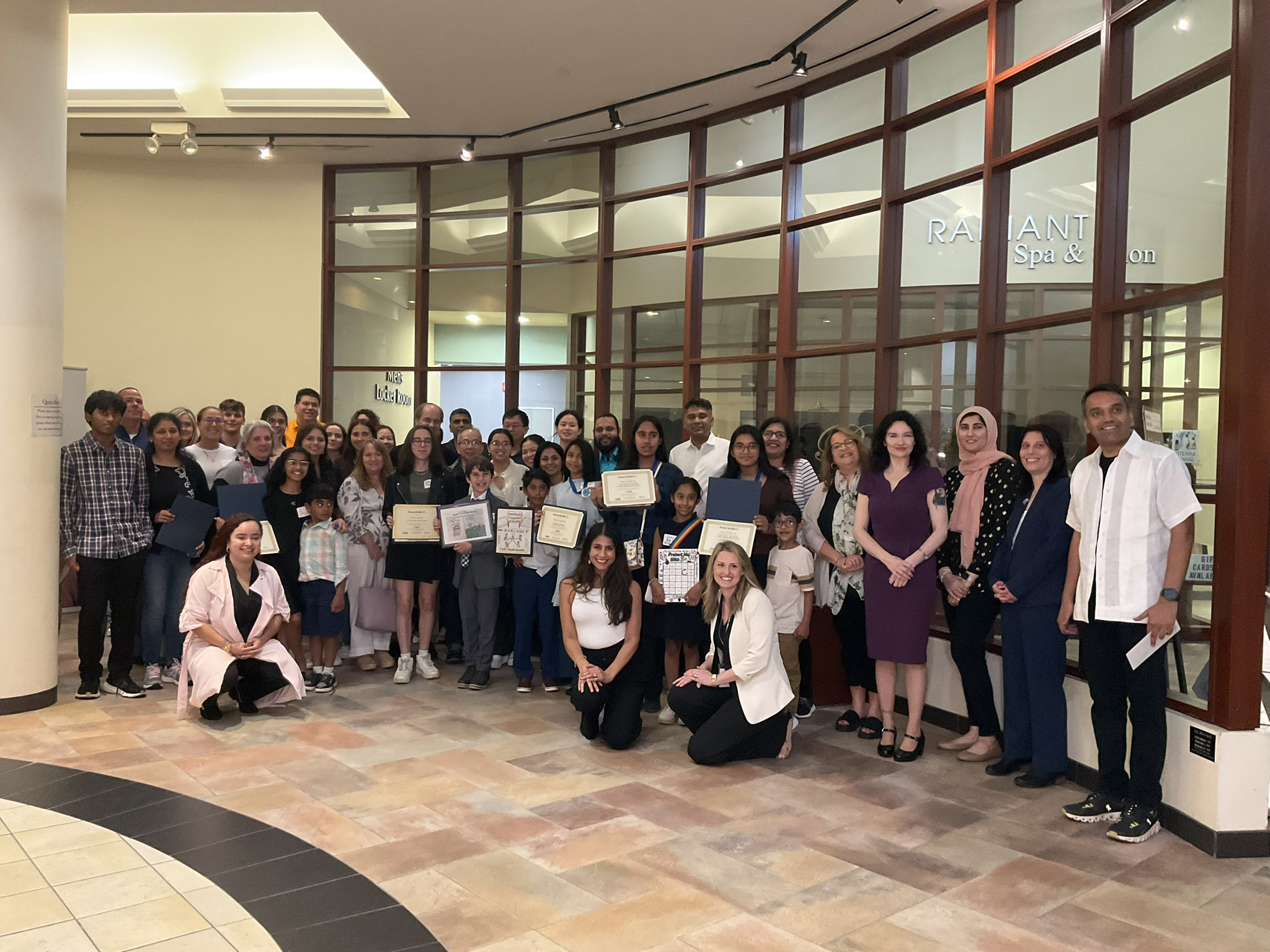 Group shot of students, parents, and staff at awards ceremony in 2024.